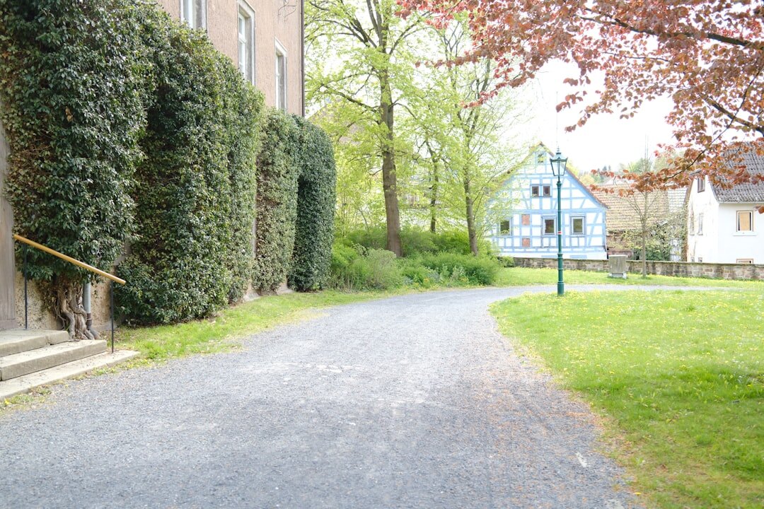 Peaceful garden path leading to a countryside house in the Czech Republic