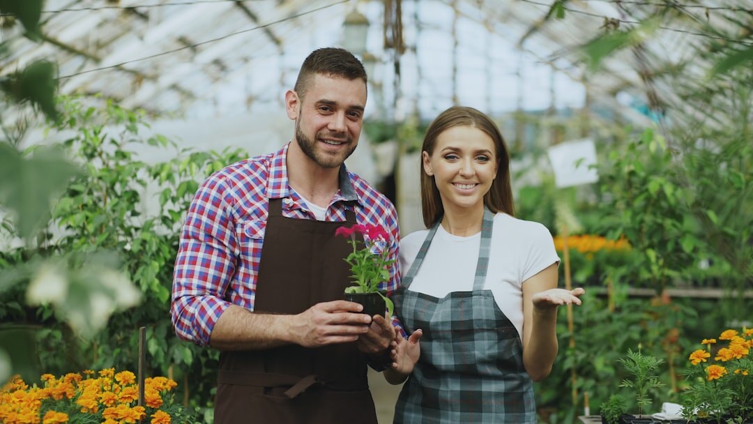 Czech couple in their fifties working together in a country garden